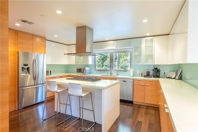 712 Orange Grove Ter, South Pasadena, CA 91030 - kitchen featuring stainless steel appliances, island range hood, dark wood-type flooring, a sink, and a kitchen island