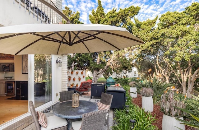 7031 Estrella De Mar Rd, Carlsbad, CA 92009 - view of patio / terrace with wine cooler and outdoor dining space