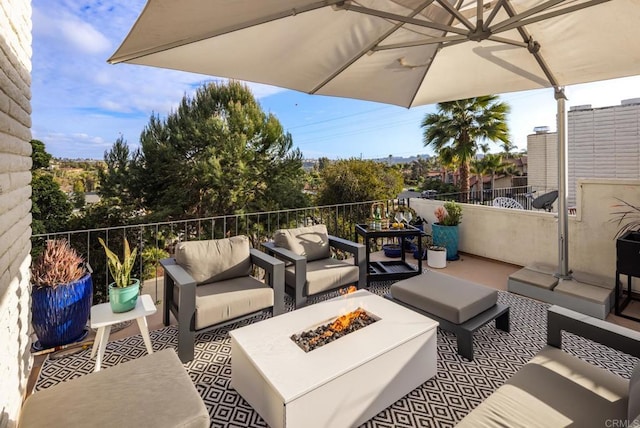 7031 Estrella De Mar Rd, Carlsbad, CA 92009 - view of patio / terrace with an outdoor living space with a fire pit