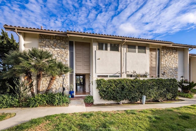 7031 Estrella De Mar Rd, Carlsbad, CA 92009 - view of front facade with stone siding and stucco siding