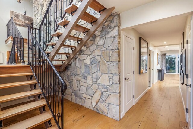 7031 Estrella De Mar Rd, Carlsbad, CA 92009 - stairs featuring hardwood / wood-style flooring