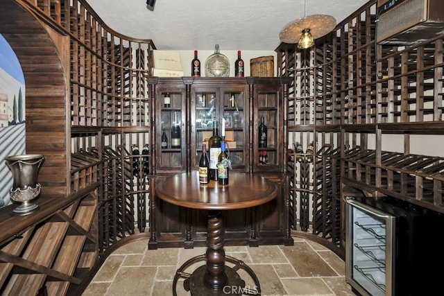 wine room featuring stone tile flooring