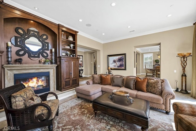 living area with a premium fireplace, baseboards, recessed lighting, and ornamental molding
