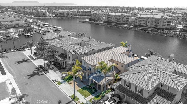 aerial view featuring a water view and a residential view