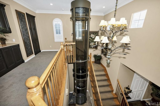 stairway with baseboards, carpet, a chandelier, and crown molding