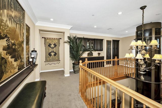 hallway with recessed lighting, ornamental molding, an upstairs landing, baseboards, and carpet flooring