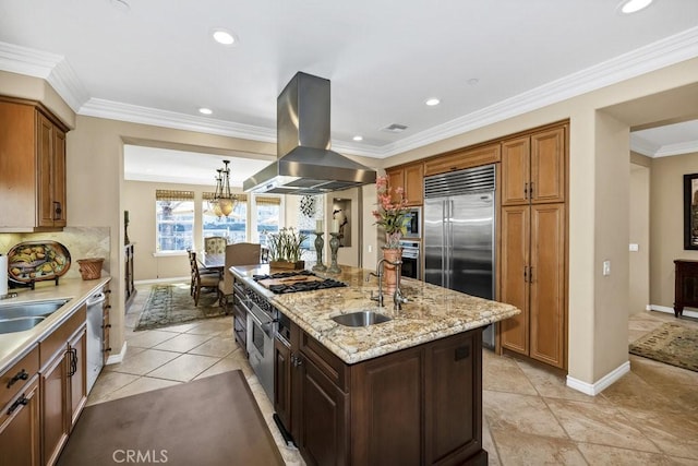 kitchen with island range hood, a sink, baseboards, a kitchen island with sink, and appliances with stainless steel finishes