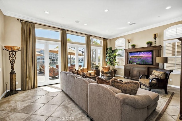 living area featuring baseboards, crown molding, french doors, and visible vents