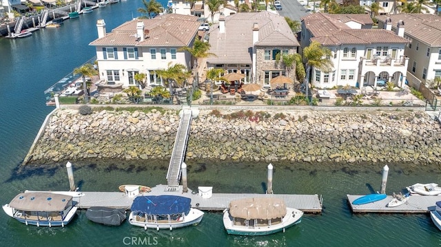 birds eye view of property featuring a residential view and a water view