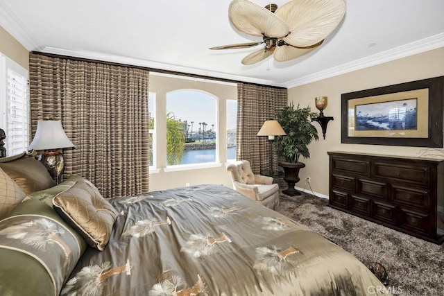 carpeted bedroom featuring ceiling fan, baseboards, a water view, and ornamental molding