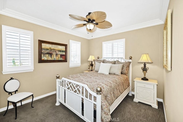 bedroom with dark carpet, a ceiling fan, baseboards, and crown molding