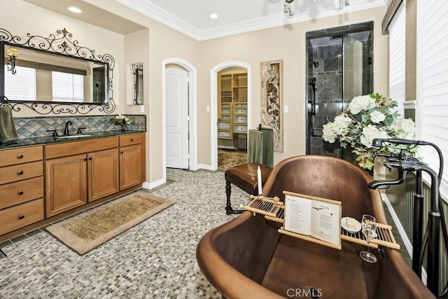 full bathroom featuring recessed lighting, crown molding, baseboards, decorative backsplash, and a stall shower