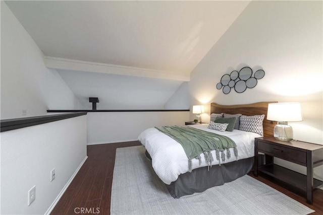 bedroom with baseboards, wood finished floors, and vaulted ceiling