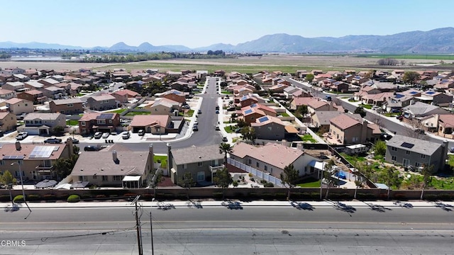 birds eye view of property with a residential view and a mountain view