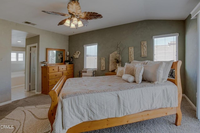 tiled bedroom with ceiling fan, visible vents, multiple windows, and carpet