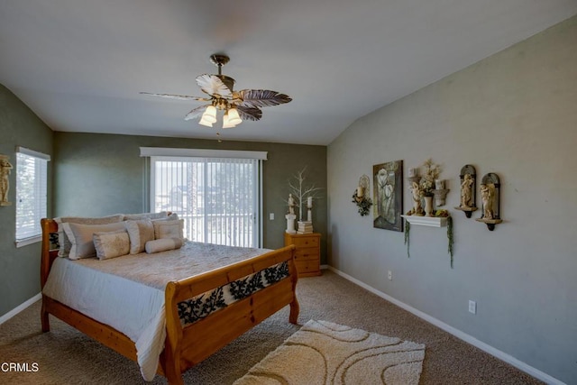 bedroom featuring baseboards, carpet floors, vaulted ceiling, and multiple windows