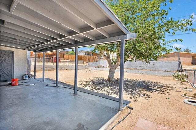 929 E Elizabeth St, Barstow, CA 92311 - fenced backyard with a patio area
