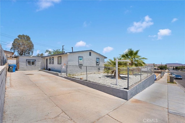 929 E Elizabeth St, Barstow, CA 92311 - view of front of property with driveway and stucco siding