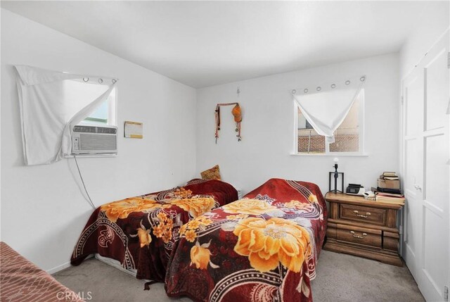 929 E Elizabeth St, Barstow, CA 92311 - bedroom featuring carpet, cooling unit, and baseboards