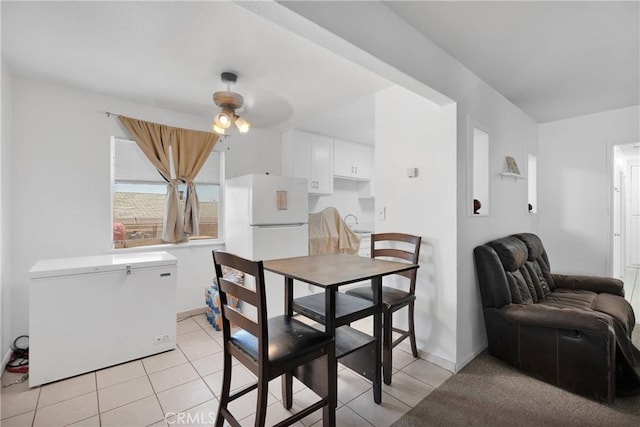 929 E Elizabeth St, Barstow, CA 92311 - dining room featuring a ceiling fan, light tile patterned floors, and baseboards