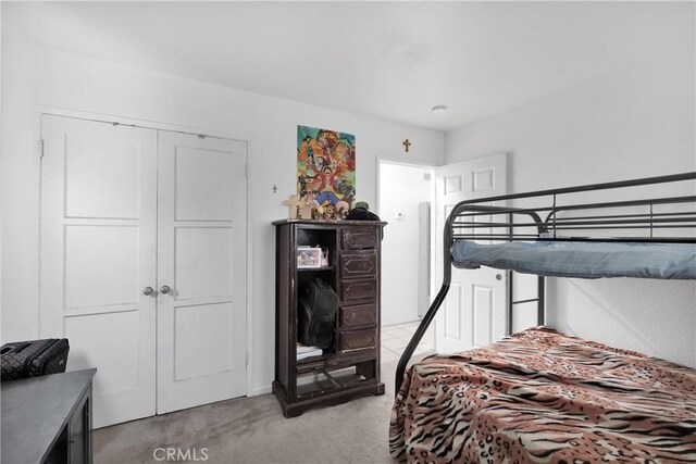 929 E Elizabeth St, Barstow, CA 92311 - bedroom with light carpet and a closet