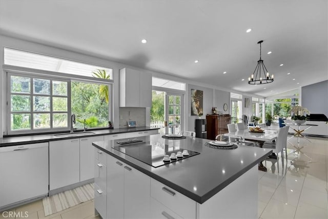 10 Stagecoach Rd, Bell Canyon, CA 91307 - kitchen with a sink, a center island, black electric cooktop, white dishwasher, and dark countertops