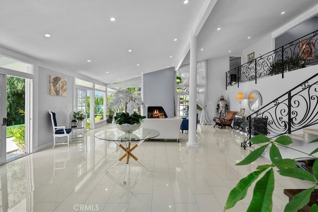 10 Stagecoach Rd, Bell Canyon, CA 91307 - tiled living room featuring stairs, a lit fireplace, and recessed lighting