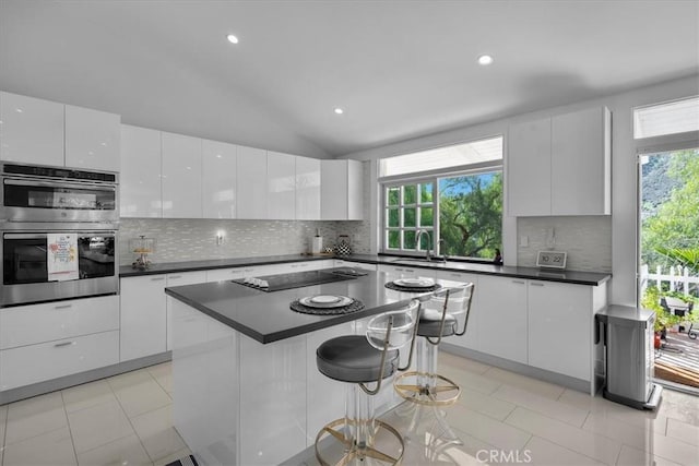 10 Stagecoach Rd, Bell Canyon, CA 91307 - kitchen featuring modern cabinets, black electric cooktop, and double oven
