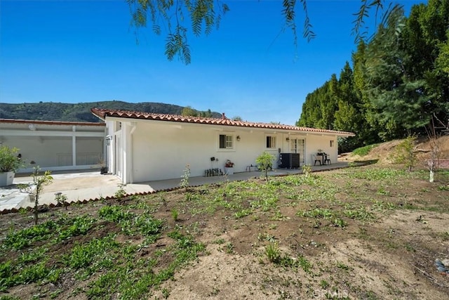 10 Stagecoach Rd, Bell Canyon, CA 91307 - back of house featuring stucco siding, a tile roof, central AC, and a patio area