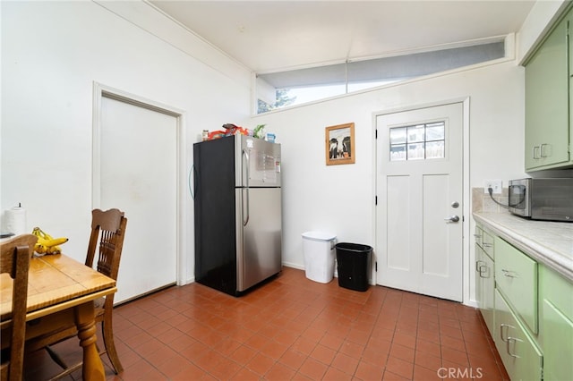 3540 Watkins Dr, Riverside, CA 92507 - kitchen with green cabinets, tile countertops, and stainless steel appliances