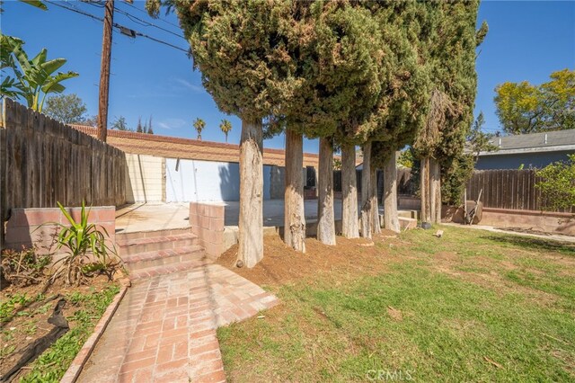 3540 Watkins Dr, Riverside, CA 92507 - view of yard featuring a patio and a fenced backyard