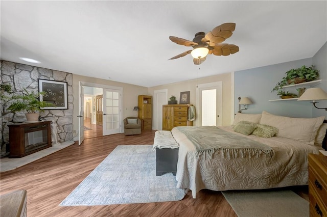 bedroom with ceiling fan and wood finished floors