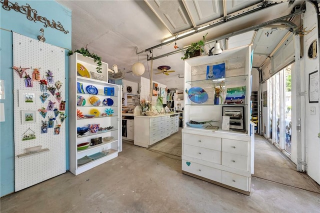 misc room with concrete flooring