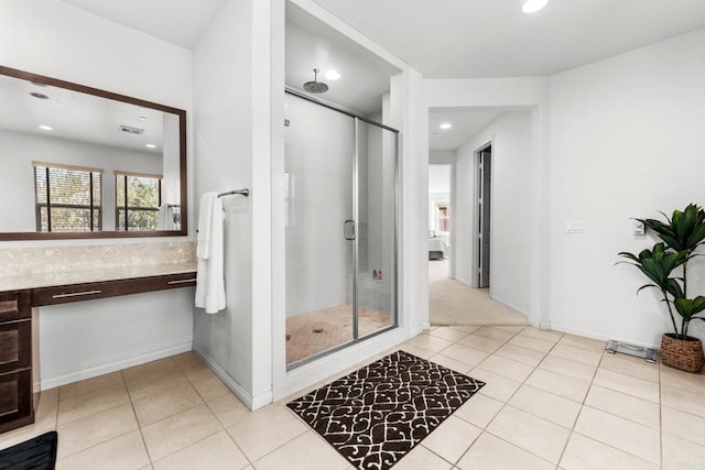 full bath with a shower stall, tile patterned floors, and recessed lighting