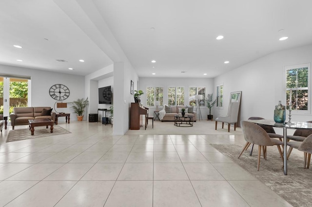 living room with plenty of natural light, recessed lighting, and light tile patterned floors