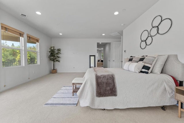 carpeted bedroom with visible vents, baseboards, and recessed lighting