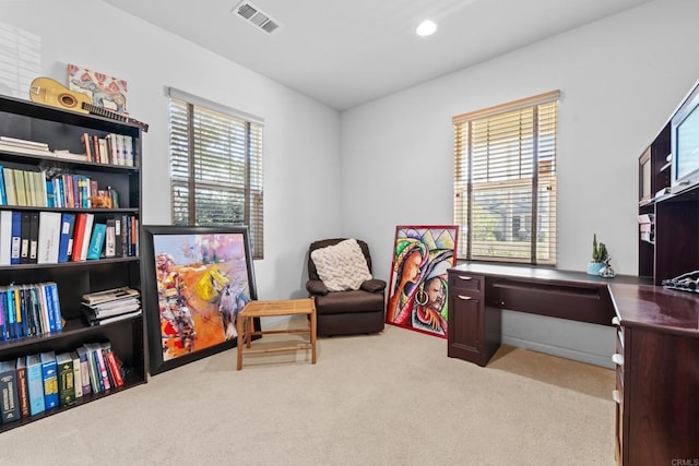 sitting room with visible vents, recessed lighting, and carpet