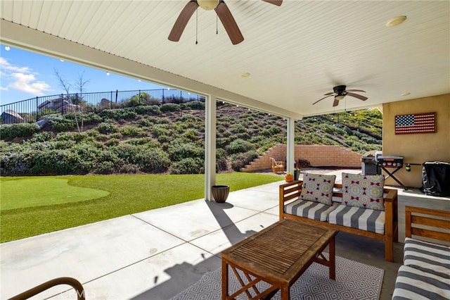 30688 Lone Pine Dr, Menifee, CA 92584 - view of patio with a ceiling fan, area for grilling, an outdoor hangout area, and a putting green