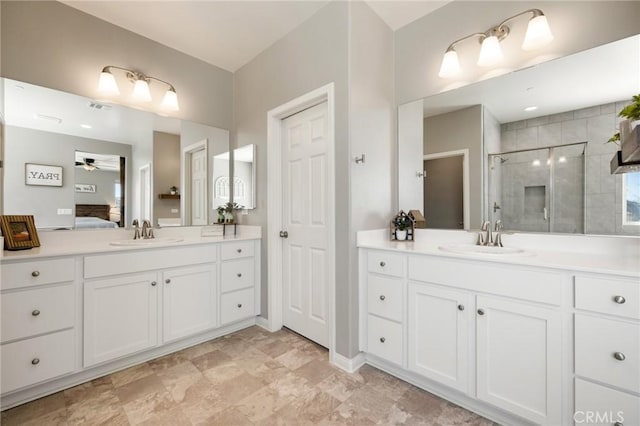 30688 Lone Pine Dr, Menifee, CA 92584 - ensuite bathroom with ceiling fan, a stall shower, two vanities, and baseboards