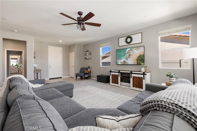 30688 Lone Pine Dr, Menifee, CA 92584 - living room featuring a ceiling fan, light carpet, baseboards, and recessed lighting