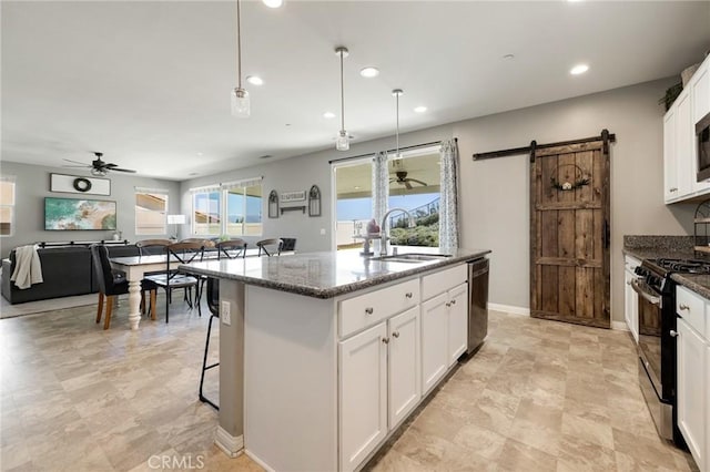 30688 Lone Pine Dr, Menifee, CA 92584 - kitchen featuring black range with gas stovetop, dishwasher, ceiling fan, a sink, and recessed lighting
