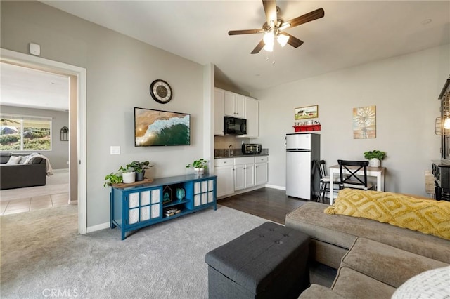 30688 Lone Pine Dr, Menifee, CA 92584 - living room with ceiling fan, dark carpet, vaulted ceiling, and baseboards