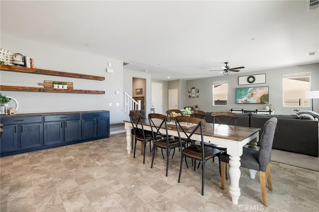 30688 Lone Pine Dr, Menifee, CA 92584 - dining area featuring a ceiling fan and stairs