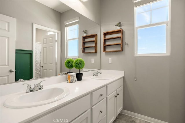 30688 Lone Pine Dr, Menifee, CA 92584 - full bathroom with double vanity and baseboards