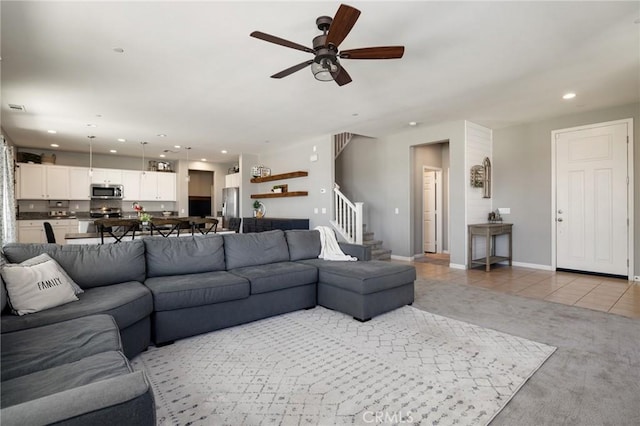 30688 Lone Pine Dr, Menifee, CA 92584 - living room with stairway, a ceiling fan, recessed lighting, light tile patterned floors, and baseboards