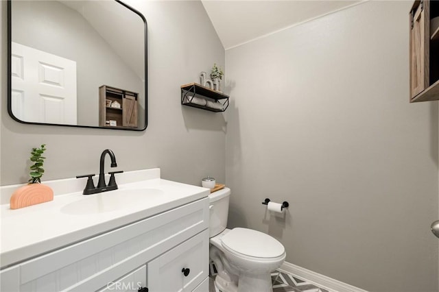 30688 Lone Pine Dr, Menifee, CA 92584 - bathroom featuring toilet, vanity, baseboards, and lofted ceiling