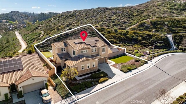 30688 Lone Pine Dr, Menifee, CA 92584 - aerial view of property and surrounding area with property parcel outlined and a mountainous background