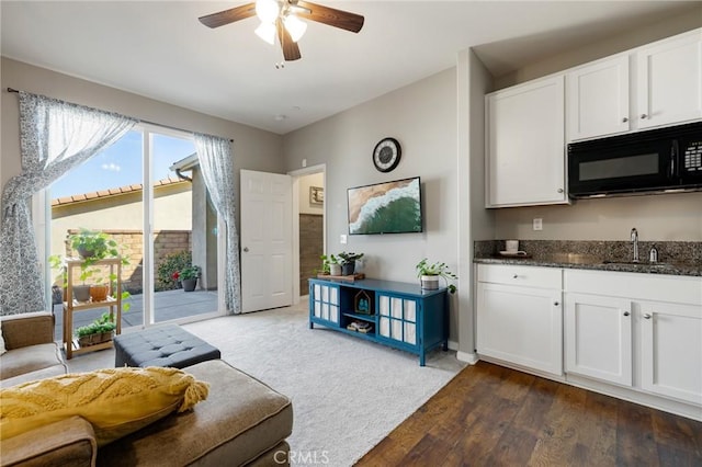 30688 Lone Pine Dr, Menifee, CA 92584 - living room with a ceiling fan, dark wood-type flooring, and baseboards