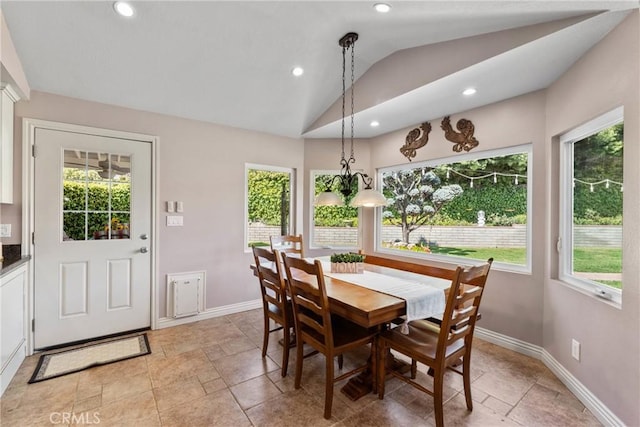 dining space featuring lofted ceiling, plenty of natural light, baseboards, and recessed lighting