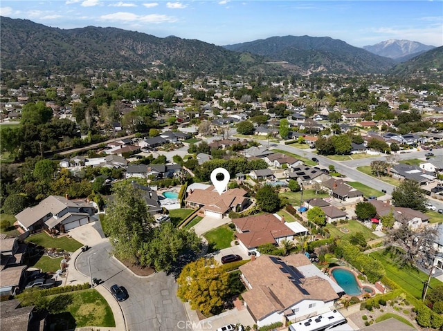 drone / aerial view featuring a residential view and a mountain view